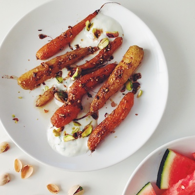 ROASTED CARROTS WITH FENNEL, CUMIN & PISTACHIOS AND CILANTRO YOGURT.