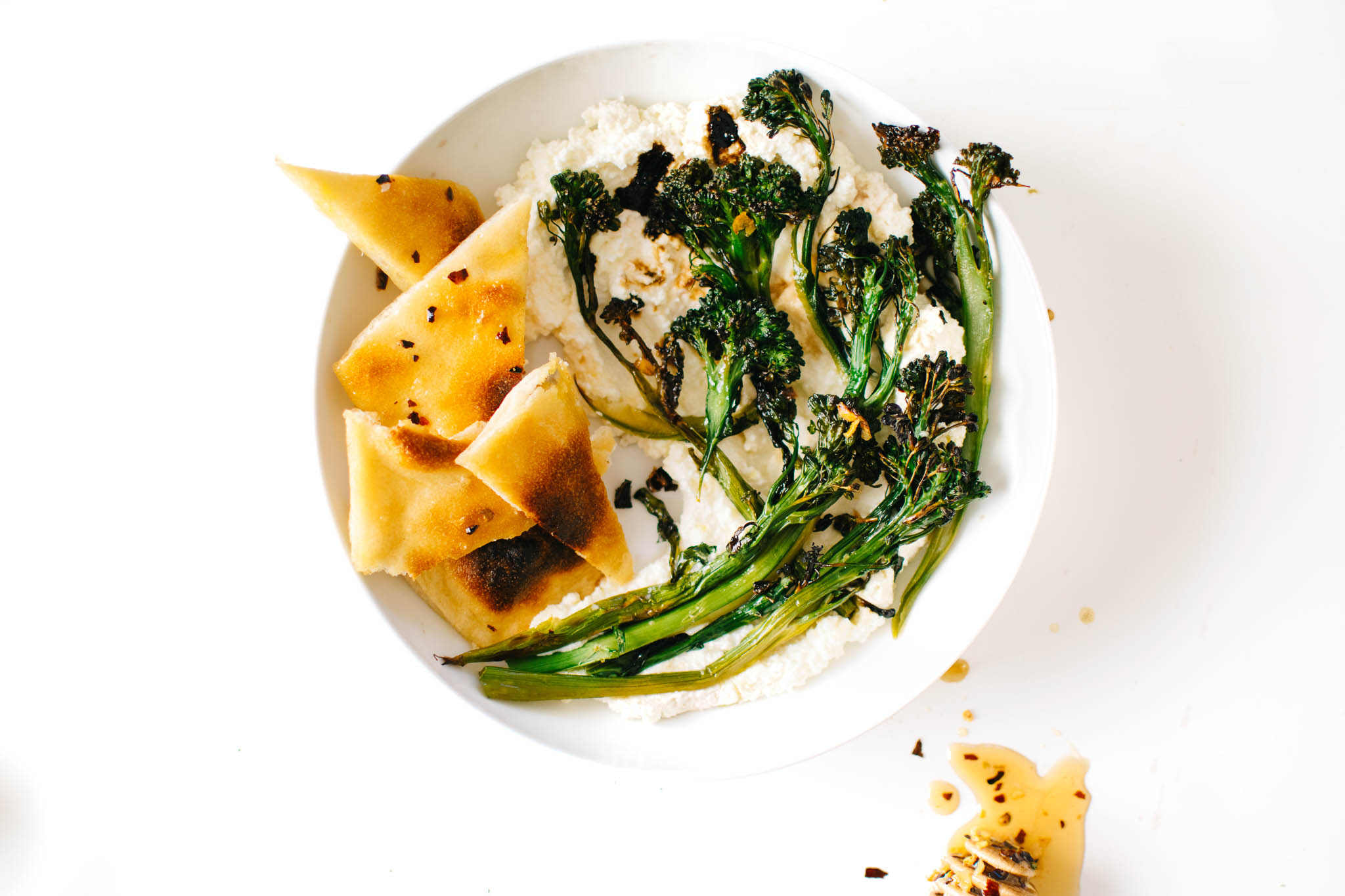 SWEET ‘N’ SPICY CHARRED BROCCOLINI WITH GARLICKY RICOTTA.