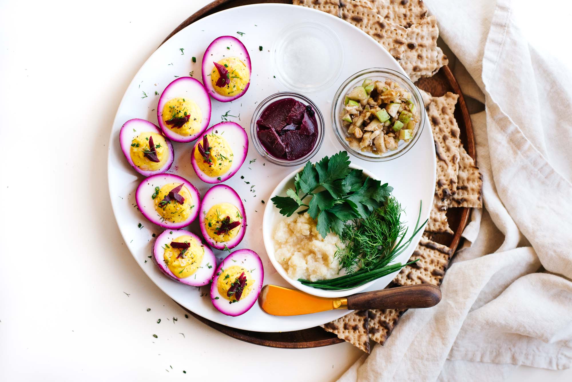 VEGETARIAN PASSOVER SEDER PLATE WITH BEET-PICKLED DEVILED EGGS.